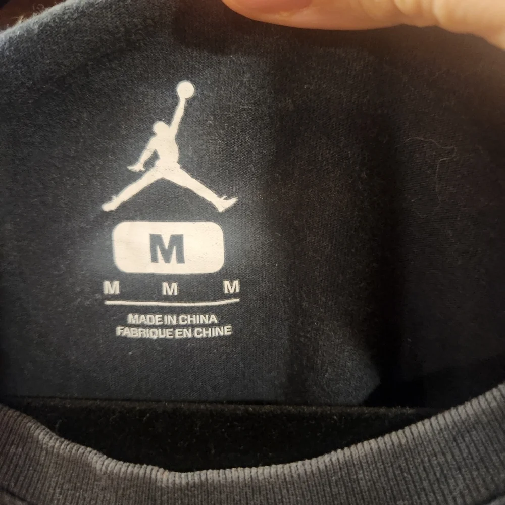 Jordan Black Tee with Orange and White Graphics